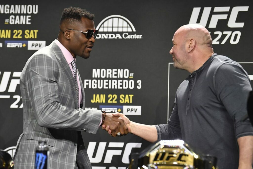 Dana White and Francis Ngannou shaking hands